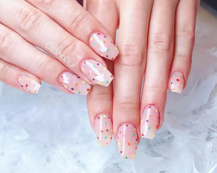 Modern French tips with a pink line detail on short coffin nails, offering a contemporary take on a classic