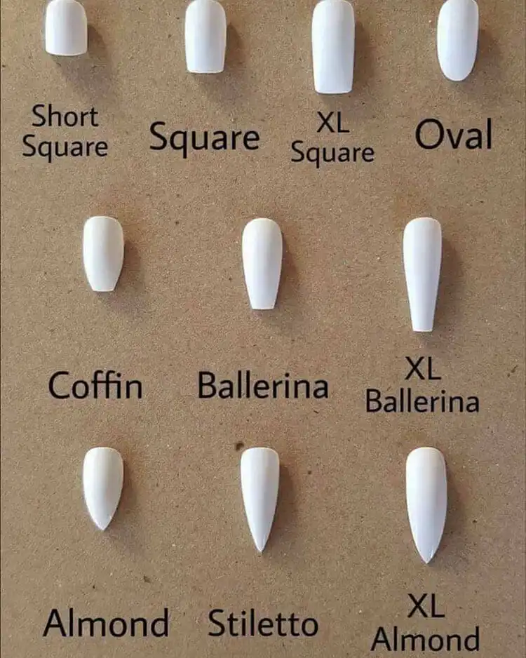 Striking white flame nail art on short coffin nails with a dark base, showcasing a modern and edgy design
