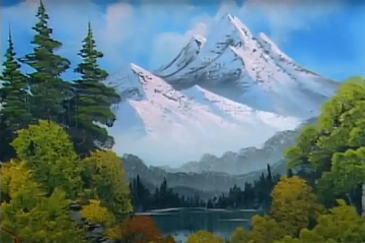 10 Bob Ross Paintings for Beginners 6 Bob Ross 'Towering Peaks' painting with a large snow-capped mountain and reflective lake.