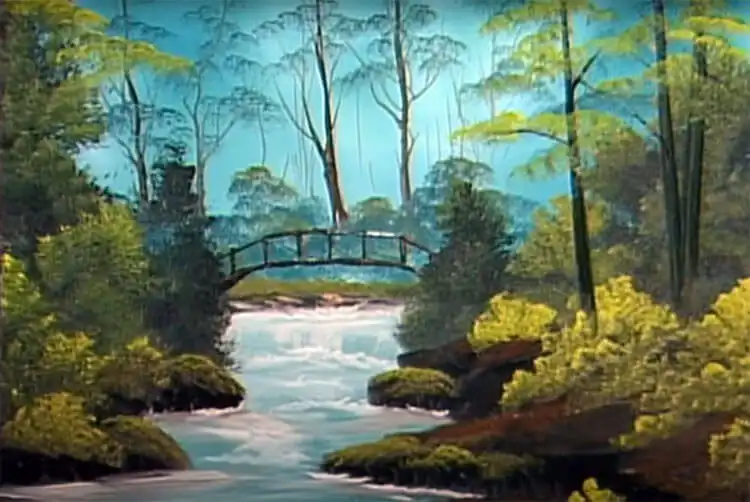 10 Bob Ross Paintings for Beginners 8 Bob Ross 'Secluded Bridge' painting of a wooden bridge over a creek in a woodland.