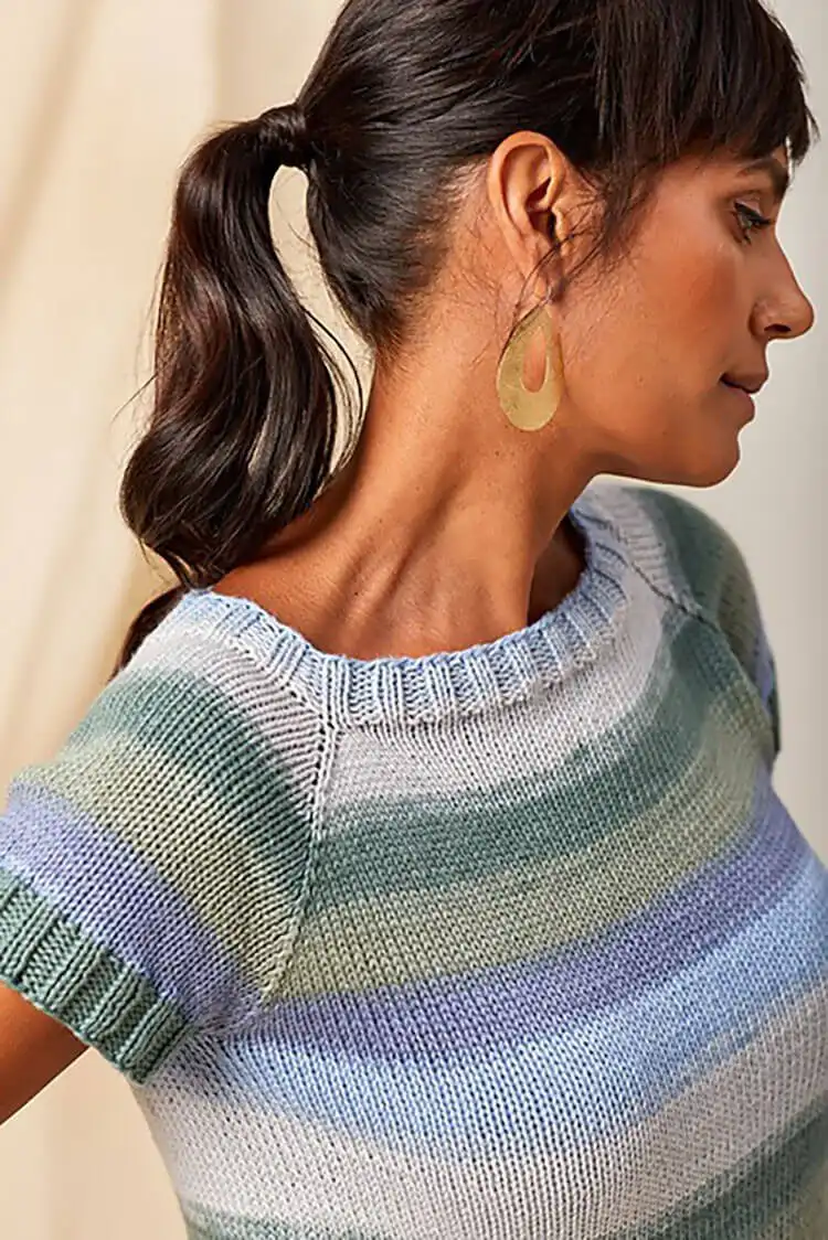 A Fresh Berries Top in a cheerful color, highlighting its short-sleeved design and effortless appeal for summer wear.