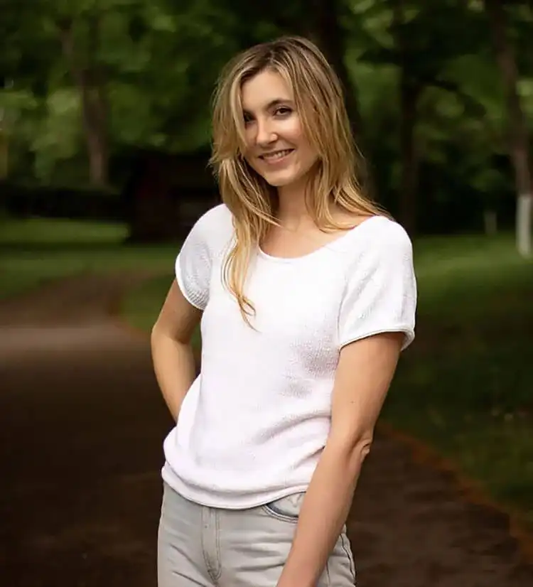 A Perfect Knit T-Shirt with a shaped neckline and relaxed fit, highlighting its smooth drape and comfortable aesthetic.