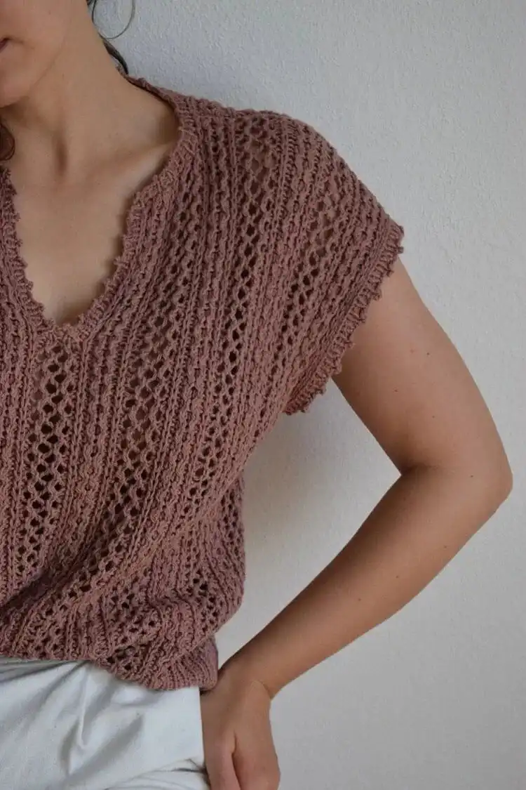 A close-up of the Toledo Top, featuring its delicate lightweight lace design crafted from cotton and linen blend yarn.