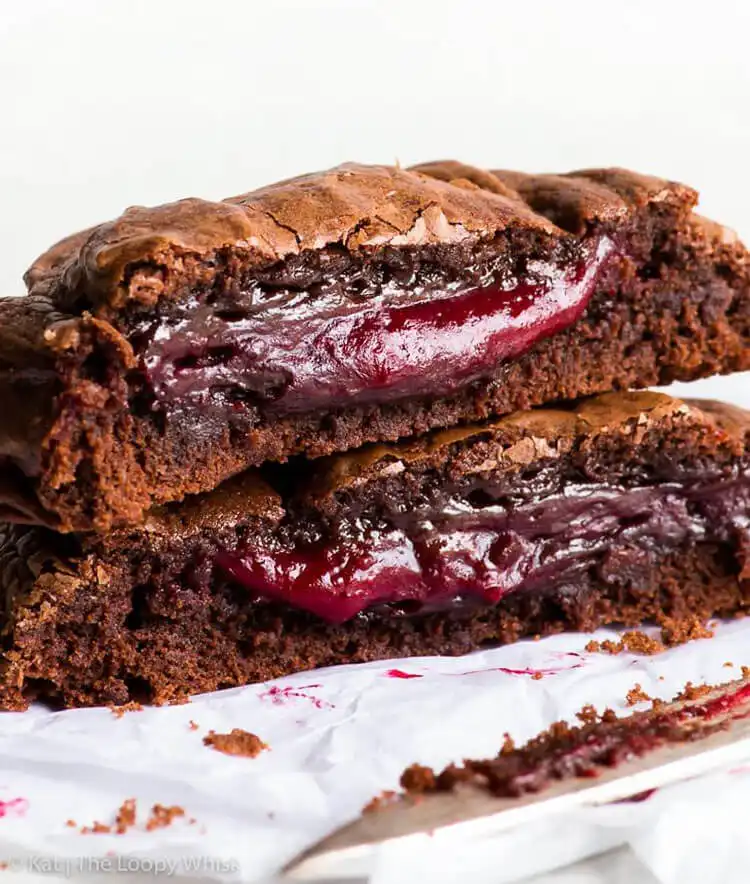 Super Fudgy Raspberry Stuffed Brownie Cookie, with tart raspberry peeking through