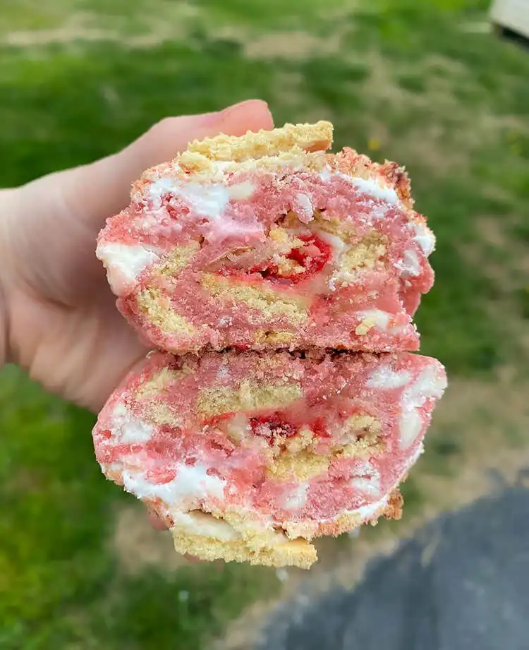 Soft Strawberry Shortcake Stuffed Cookie with a creamy strawberry filling oozing out