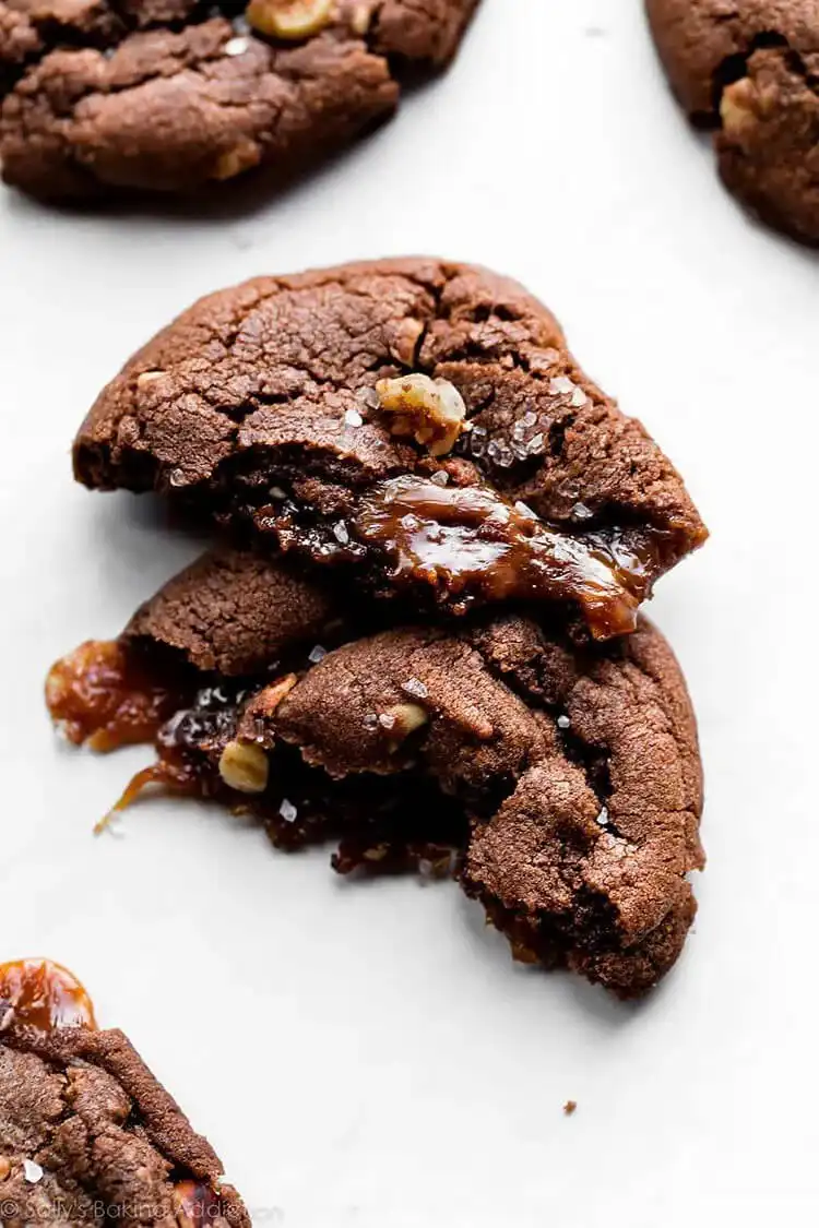 Caramel Stuffed Nutella Cookie, split open to reveal gooey caramel and rich Nutella