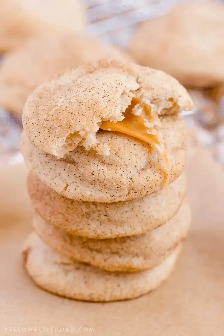 Warm Caramel Stuffed Snickerdoodle Cookie with visible cinnamon sugar coating and caramel center