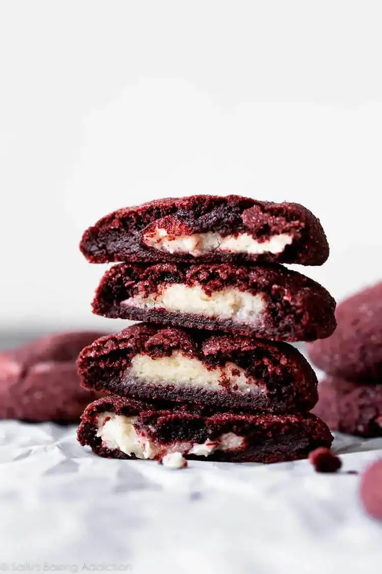 Cream Cheese Stuffed Red Velvet Cookie, showing the rich red cookie and white cream cheese swirl