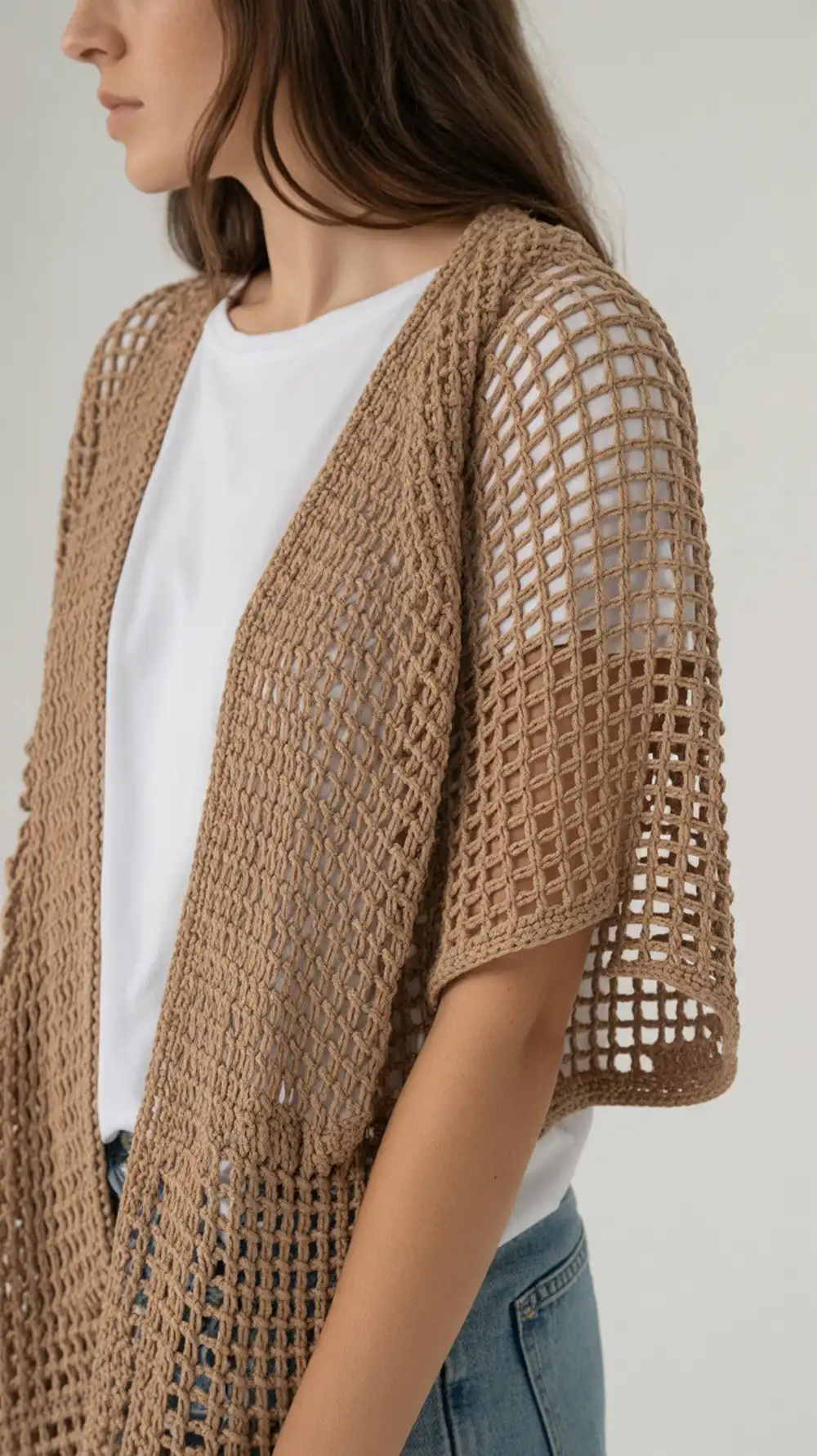 14 Crochet Mesh-Lace Summer Shrug Ideas 7 Sabrina Shrug, an airy Tunisian crochet cocoon with an open, lacy stitch texture.