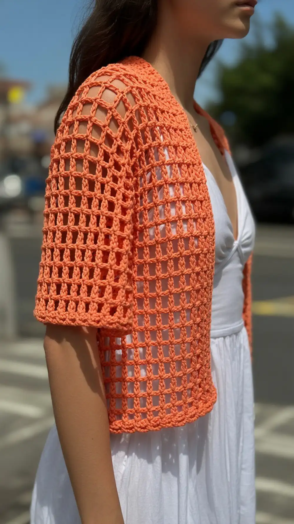 14 Crochet Mesh-Lace Summer Shrug Ideas 9 Positano Mesh Shrug by Swool Nordic, a graphic modular mesh constructed from four rectangles in vibrant orange.