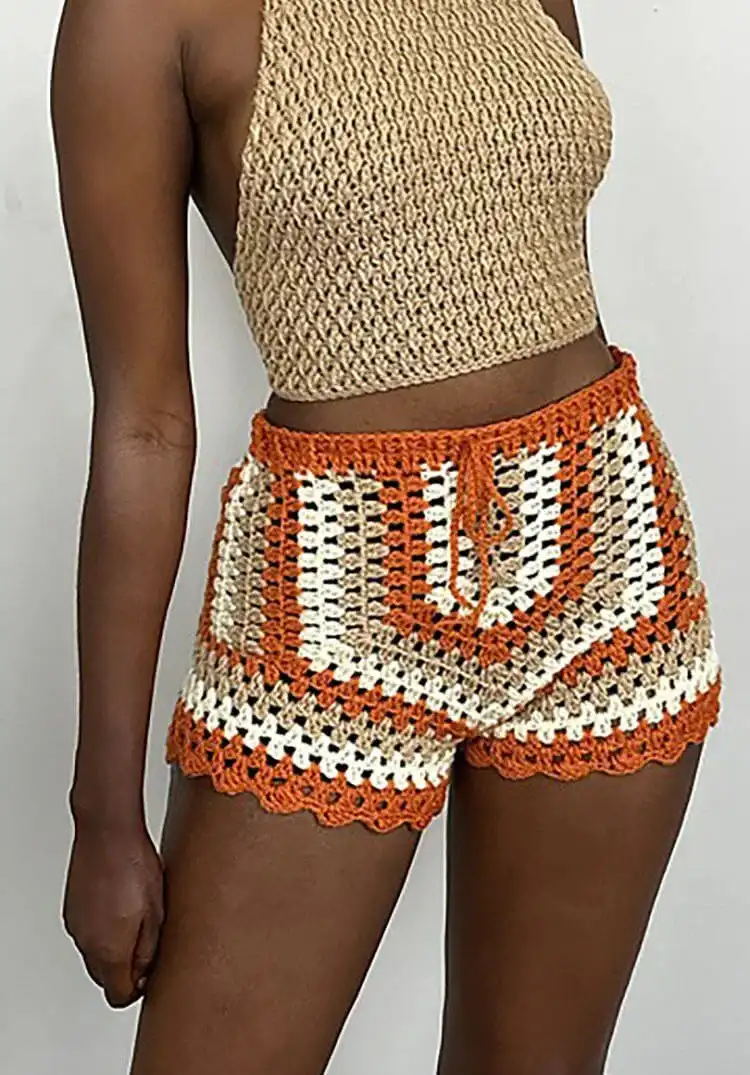 14 Gorgeous Crochet Shorts Patterns for Women 3 Stylish granny stripe crochet shorts in multi-colored yarn, demonstrating comfort and classic design.