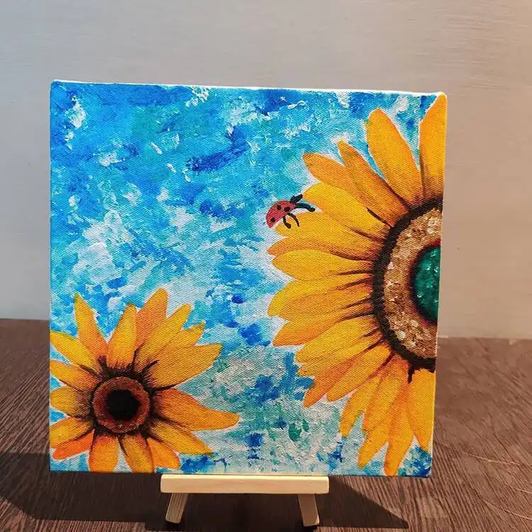 Beginner acrylic canvas painting featuring a vibrant floral arrangement with various blooms, part of 15 Acrylic Canvas Painting Ideas for Beginners - Flowers