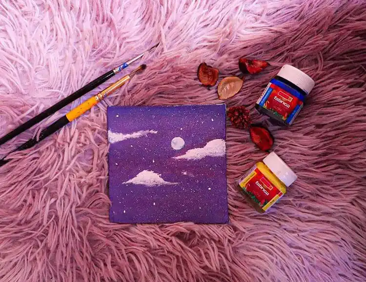 Mini canvas painting of a night sky with clouds, ideal for quick projects.