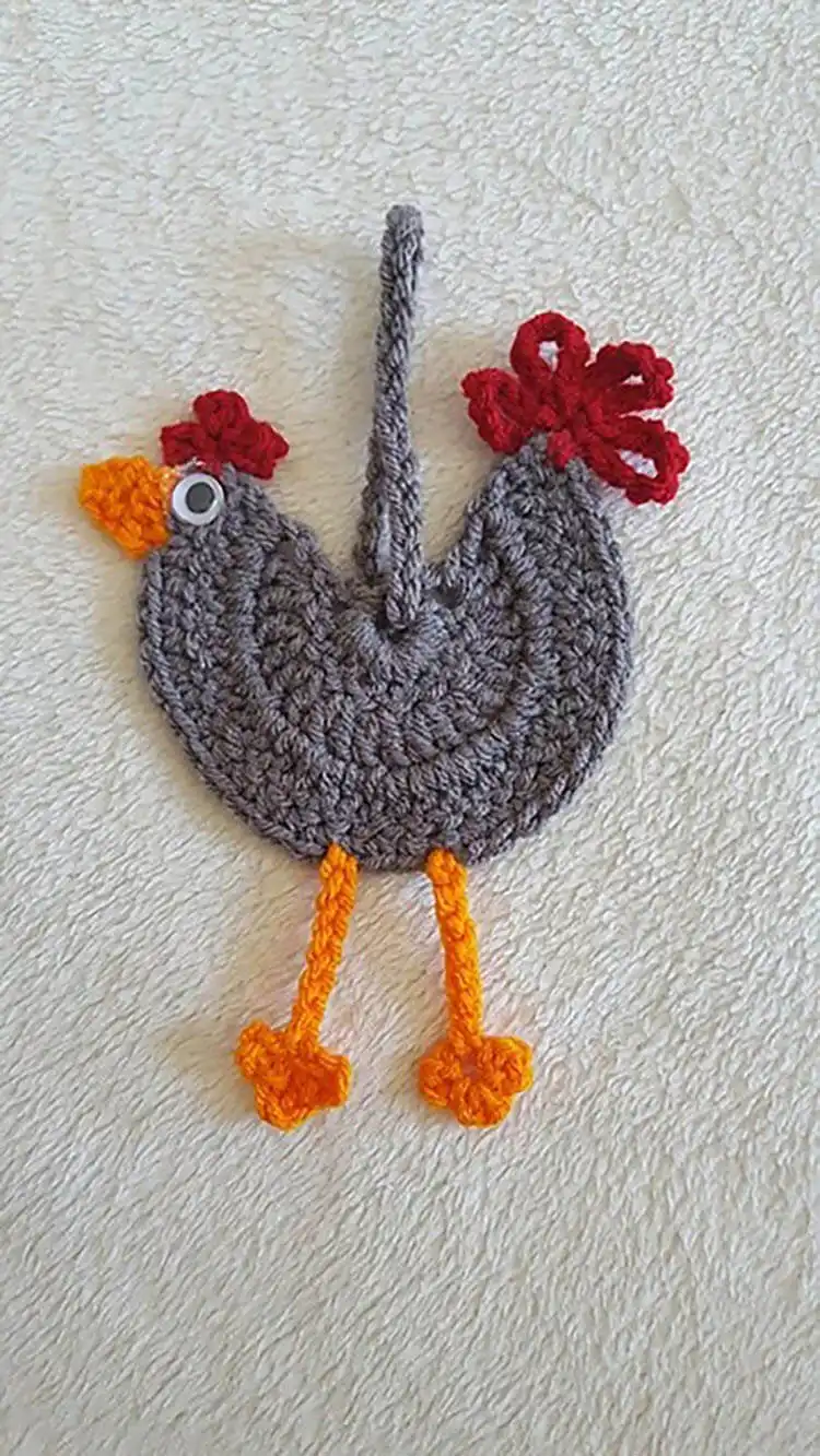 A delicate Crochet Chicken Ornament, ideal for hanging in a kitchen or as a unique festive decoration.