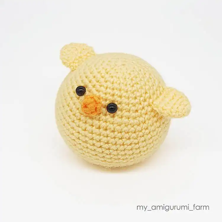 A classic Amigurumi Chick, small, round, and cuddly, a perfect example of cute stuffed animals.