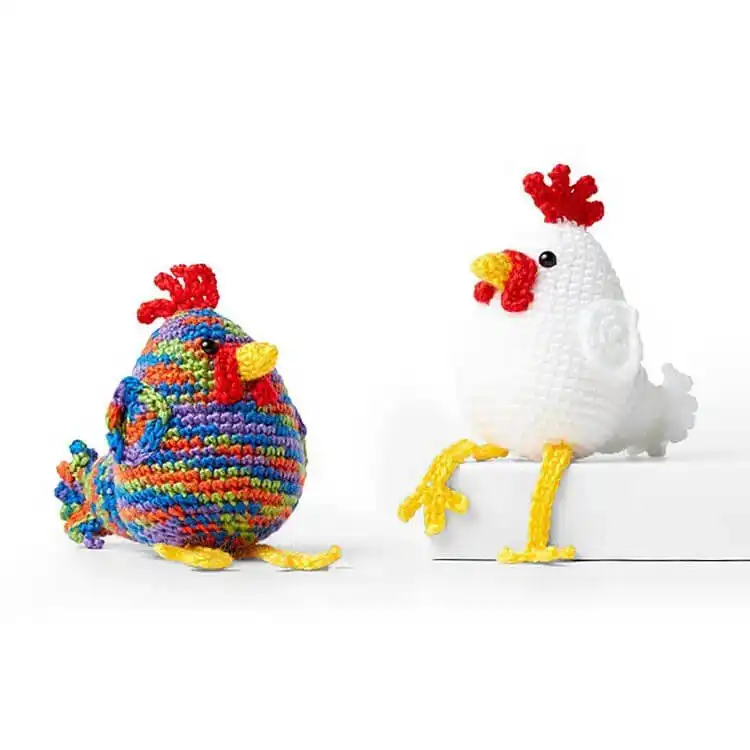 A majestic Crochet Chicken Rooster with vibrant colors, showcasing its prominent comb and tail feathers.