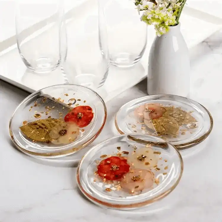 A beautiful collection of 15 Fun and Easy Resin Crafts for Beginners including coasters, jewelry, and decorative items, showcasing vibrant colors and clear finishes.