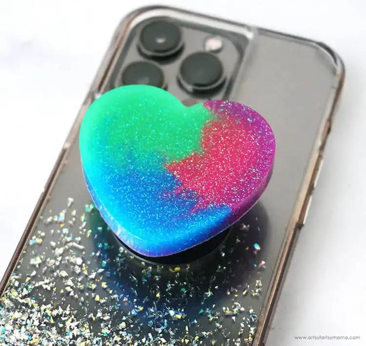 A color-changing resin phone grip with swirling patterns, demonstrating its thermochromic properties.