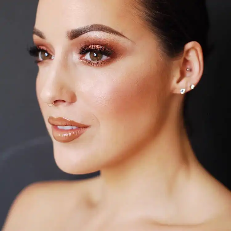 15 Halloween Makeup Ideas for Women - Easy Deer Makeup 3 Halloween makeup look featuring subtle glitter accents on the eyelids, enhancing a glamorous or magical theme.