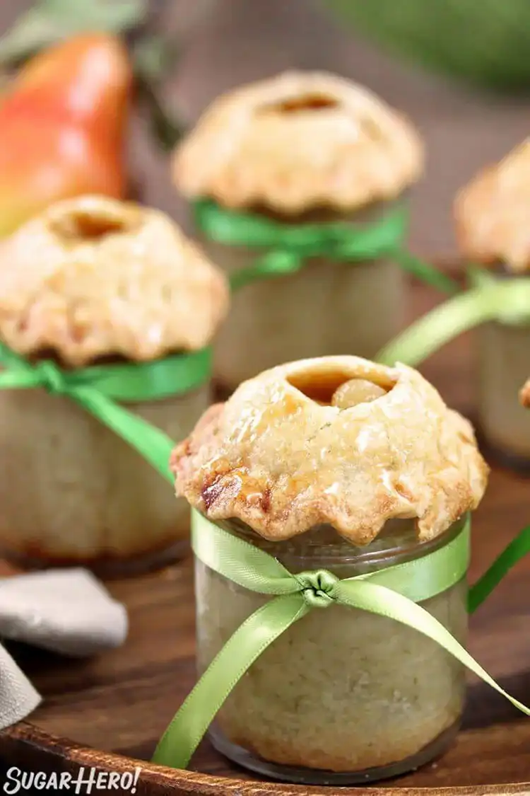 Pear Pie in a Jar featuring spiced pear filling and a flaky pie crust, ideal for autumn.