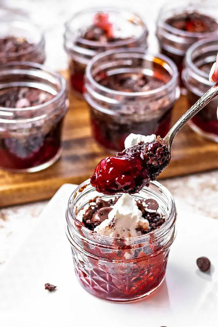 Chocolate Cherry Dump Cake in a Jar with a gooey mix of chocolate cake, cherry pie filling, and butter.