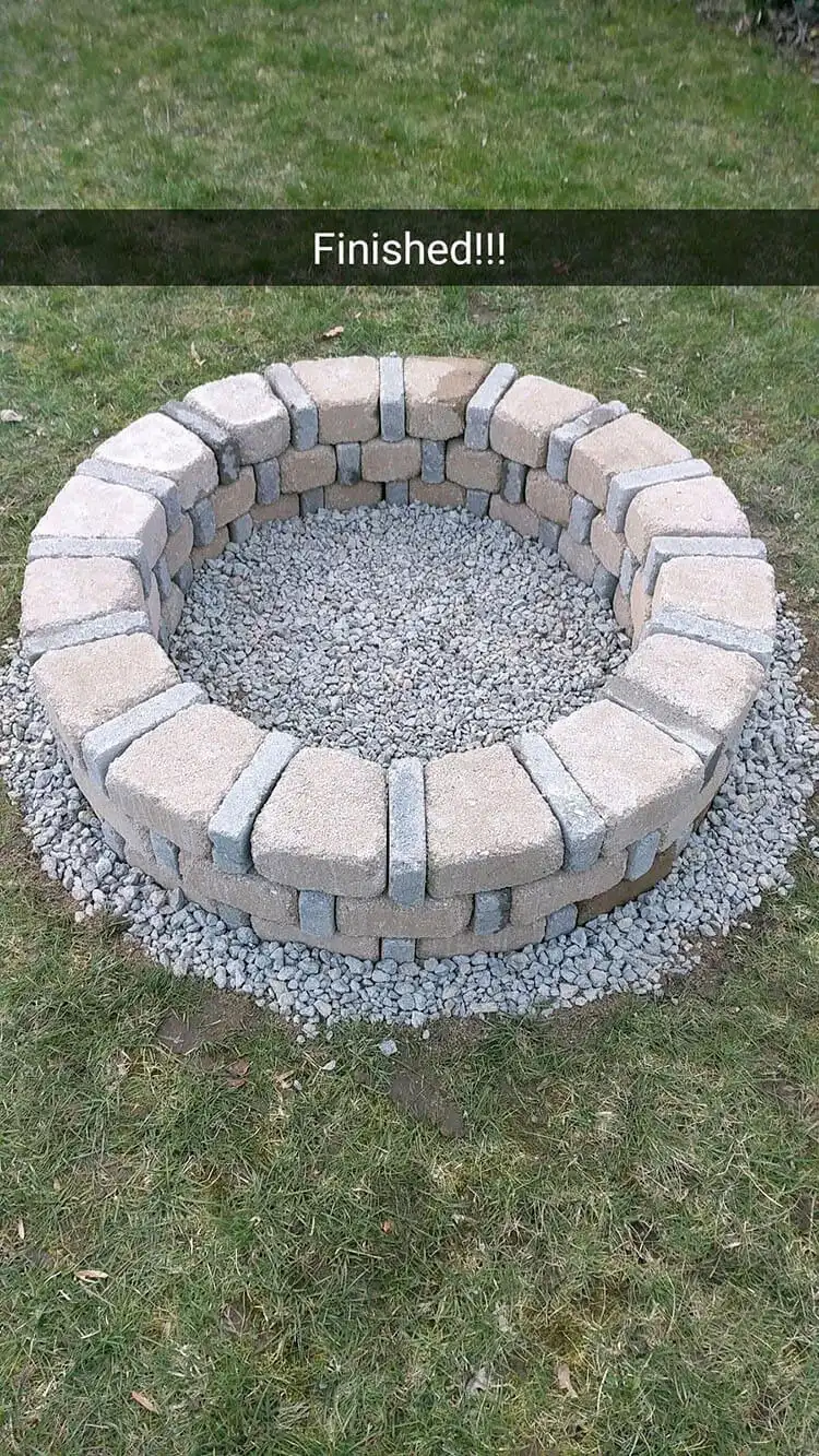 Traditional DIY Brick Fire Pit For Only $80, made from classic red bricks in a circular pattern, providing a timeless and cozy backyard element.