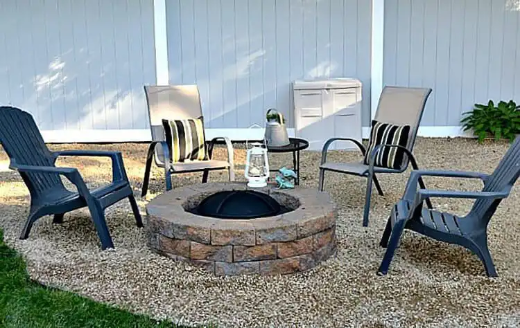 Rustic DIY Weekend Fire Pit built with stacked reddish-brown pavers, featuring a clean circular design ready for weekend enjoyment.