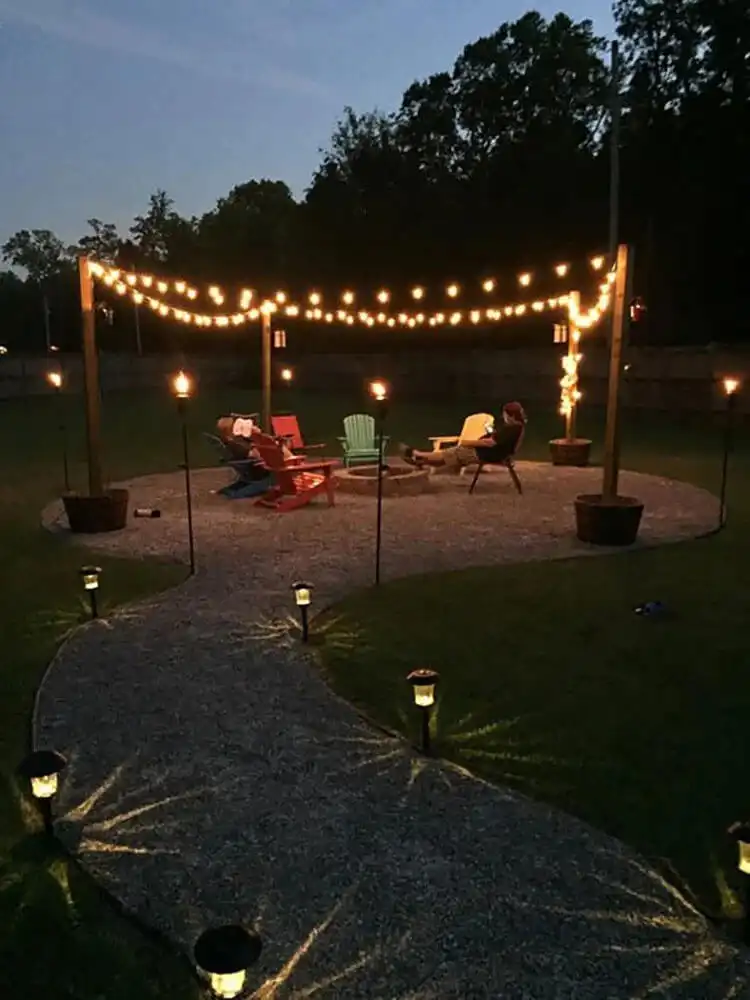 Cohesive DIY Fire Pit and Seating Area, showcasing a rectangular stone fire pit integrated into a curved patio with matching built-in stone benches.