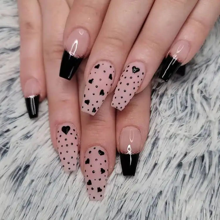 Sweet pink and black nails with tiny black hearts and polka dots, an idea from 16 Extraordinary Pink And Black Nail Design Ideas - French Tip Square Acrylic Nails