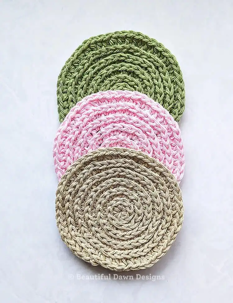 Crochet swirl coaster in contrasting colors, vertical orientation