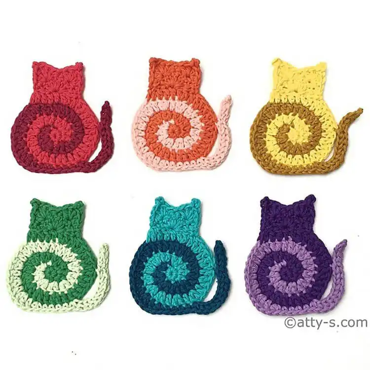 Cute crochet swirly cat coasters with distinct cat features