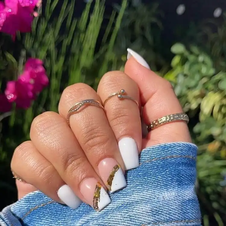 Medium-length square white and gold nails for everyday stylish inspiration.