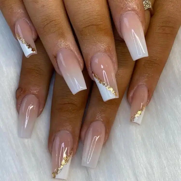 Sophisticated ombre white and French tip coffin nails with subtle gold details.