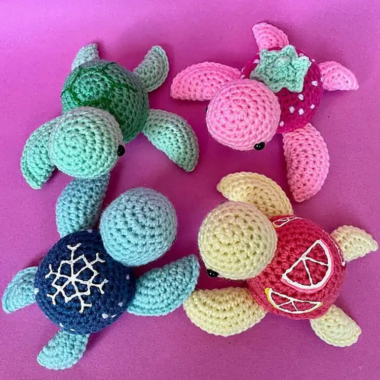A customizable blue and green crochet sea turtle, showcasing adaptable design and color options for personal flair.