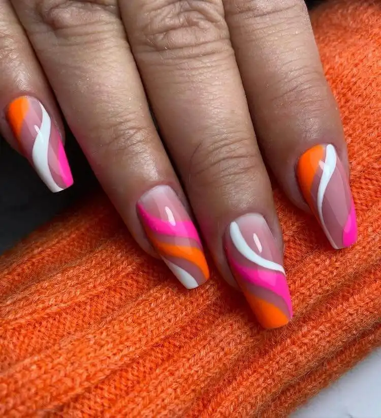 18 Simple Orange Nail Designs - Heart Nails 11 Beautiful nail art combining pink, orange, and white colors in a harmonious pattern or color block.