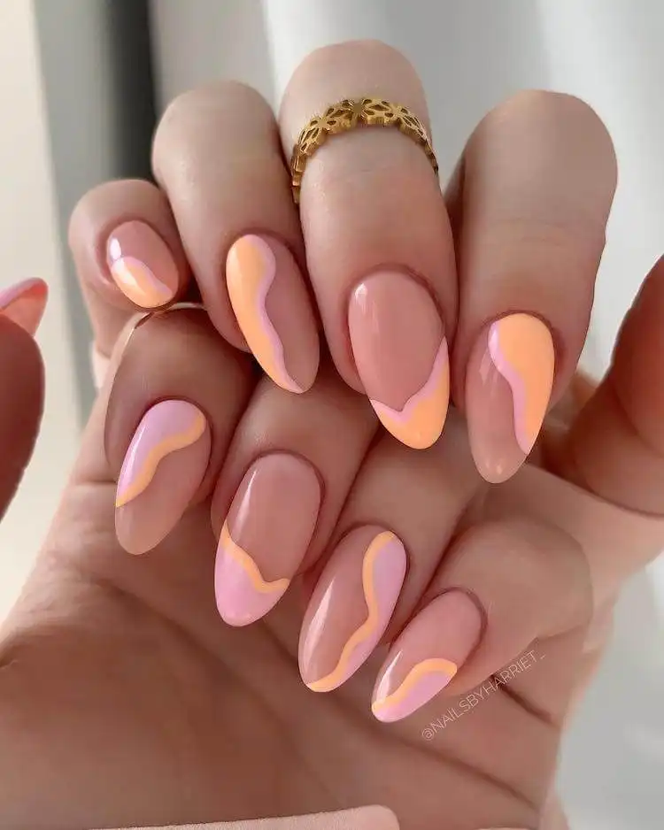 18 Simple Orange Nail Designs - Heart Nails 13 Pastel orange and purple nails with a whimsical design, perfect for spring and summer vibes.