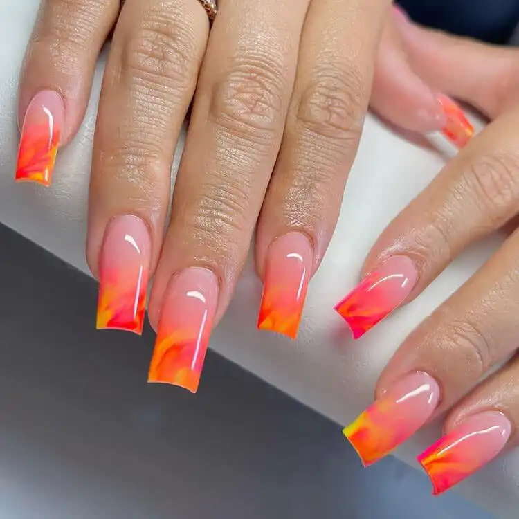 18 Simple Orange Nail Designs - Heart Nails 19 Luxurious marble effect nails with swirls of orange, white, and gray.