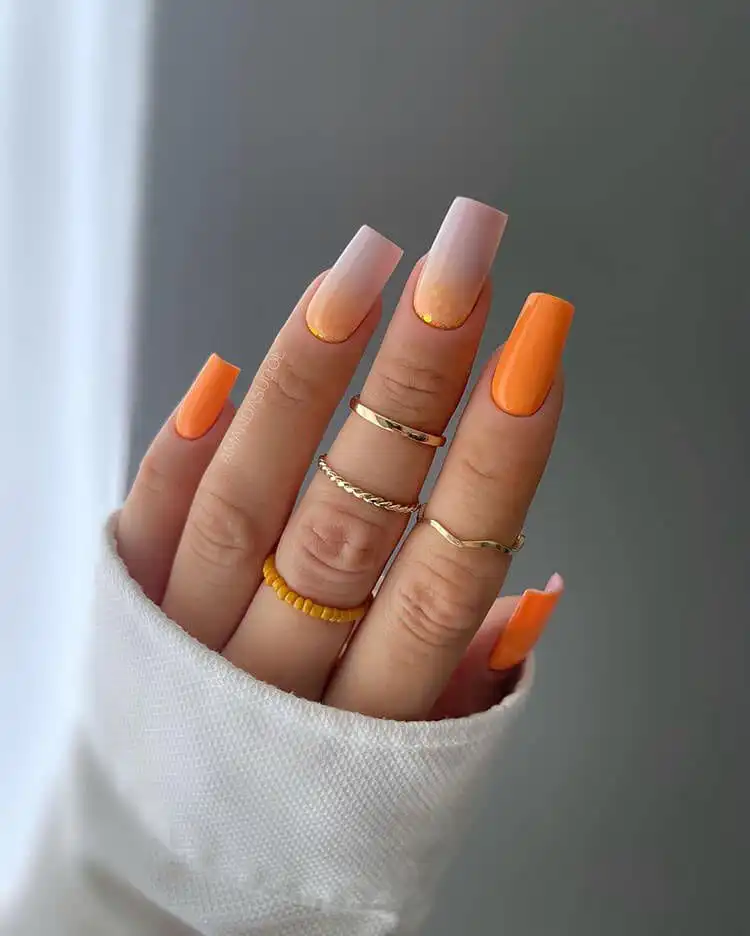 18 Simple Orange Nail Designs - Heart Nails 22 Sparkling orange glitter effect on nails, applied either at the base or as a full glitter coat.