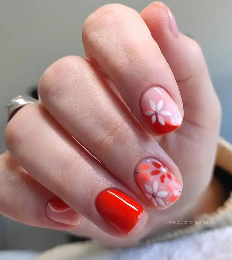 18 Simple Orange Nail Designs - Heart Nails 24 Simple yet eye-catching design with white and orange flowers on a subtle beige background.