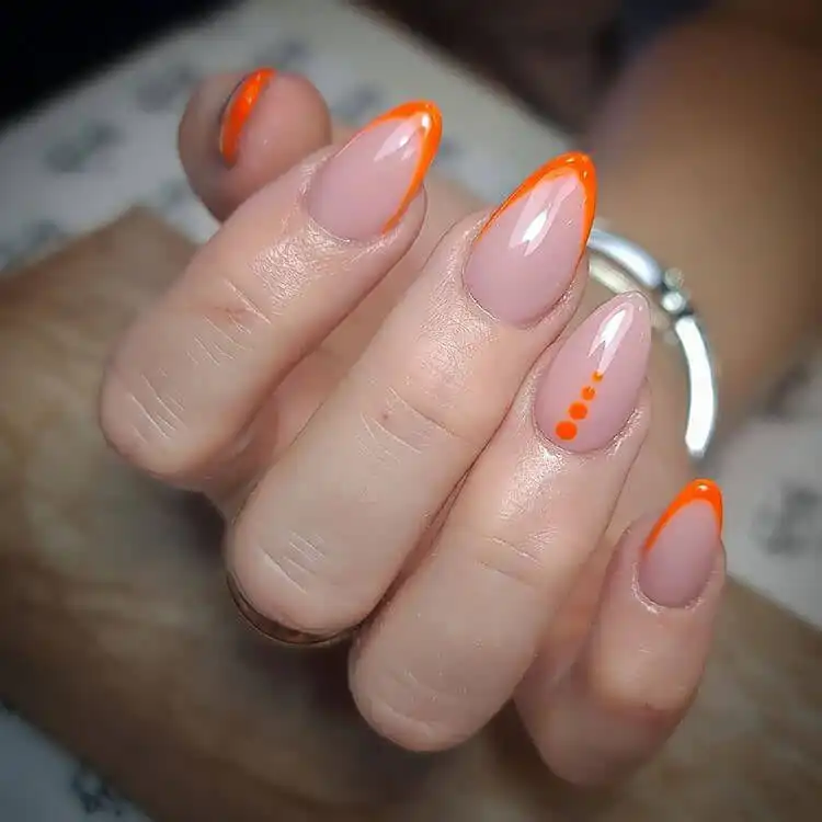 18 Simple Orange Nail Designs - Heart Nails 25 Classic French manicure with vibrant orange tips and playful polka-dot accents.