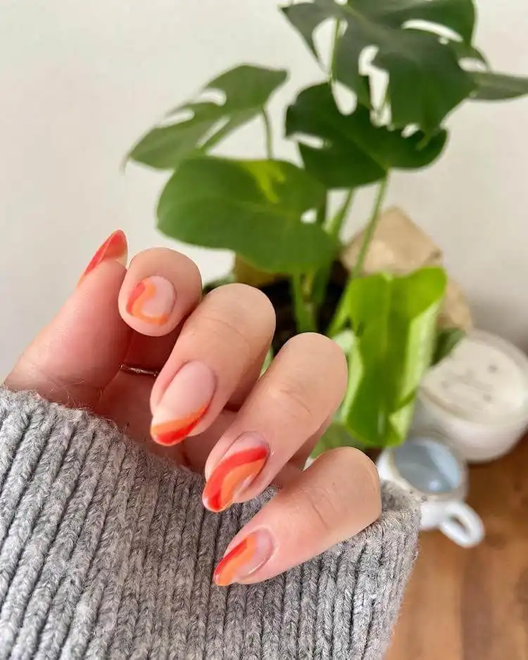 18 Simple Orange Nail Designs - Heart Nails 4 Nails painted with a sophisticated blend of different shades of orange, from light to dark, demonstrating versatile orange nail designs.