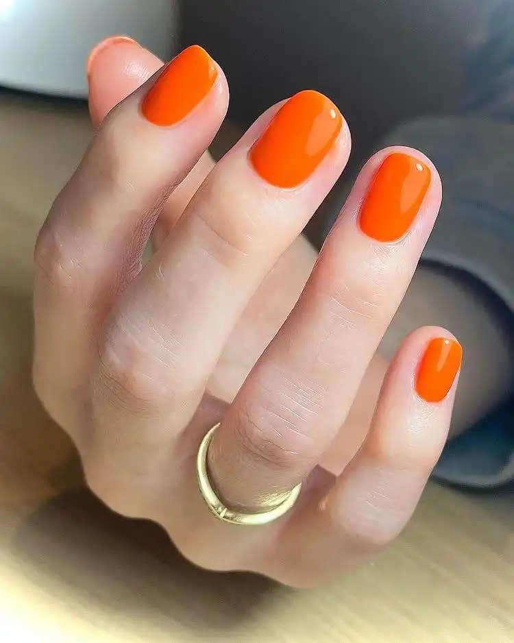 18 Simple Orange Nail Designs - Heart Nails 7 Classic bright solid orange polished nails, a simple yet striking look for a fresh manicure.