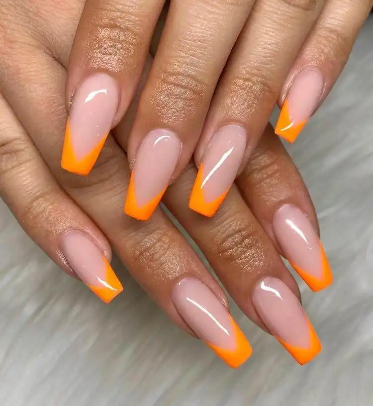 18 Simple Orange Nail Designs - Heart Nails 10 Modern French tips featuring electric neon orange polish instead of traditional white.