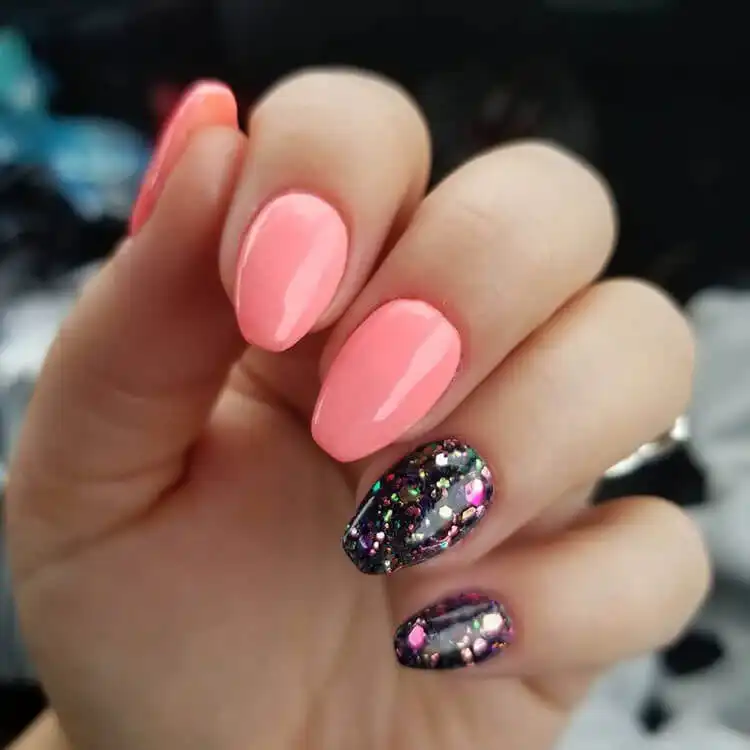 Trendy short coffin cow print nails featuring black spots on a pink base, offering a cute and unique animal print style.