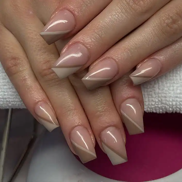 Short coffin nails with a delicate lavender French tip design.