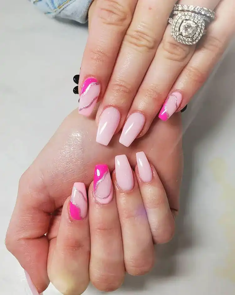 Creative short coffin tan nails featuring unique black designs on each nail, including happy faces and abstract patterns, for a personalized look.