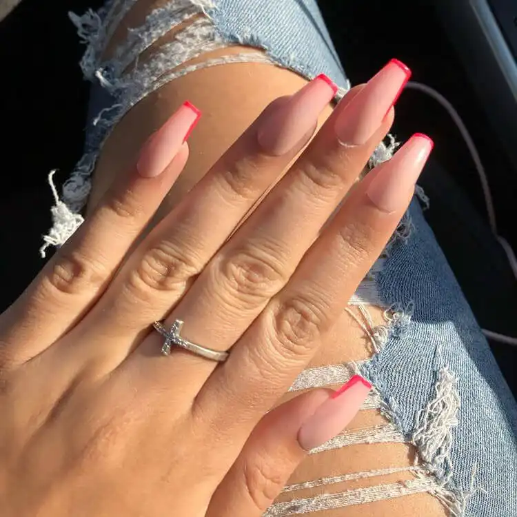 Elegant short coffin pink nails displaying both soft and bright pink shades with intricate glitter swirl details on accent nails.