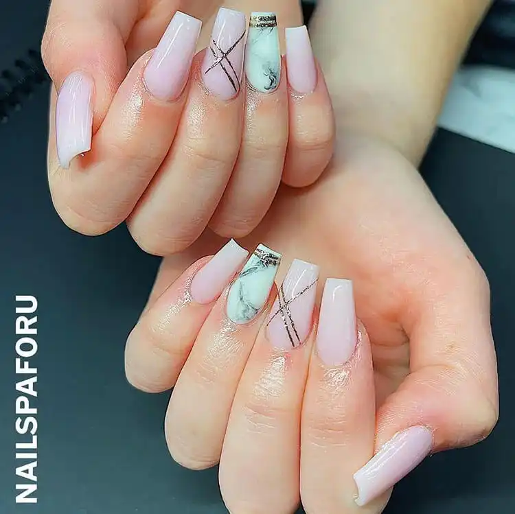 Classic short coffin nude nails showcasing a simple, clean, and timeless look that highlights the elegant shape of the nail.