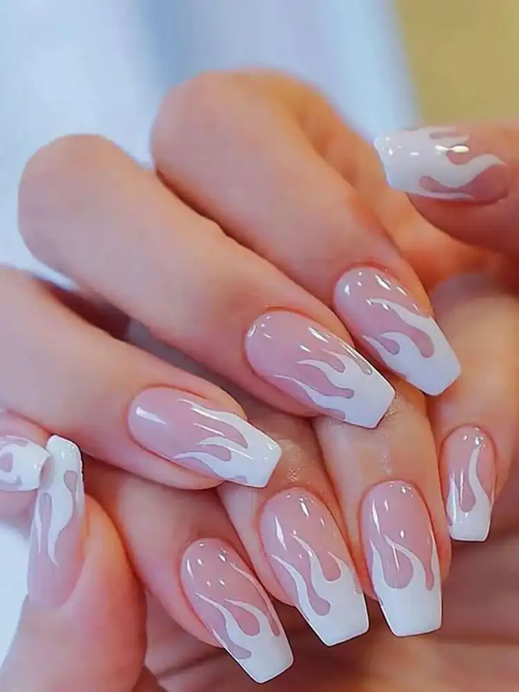Short coffin nails featuring a striking white flame design against a neutral or translucent base, creating an edgy and dynamic look.