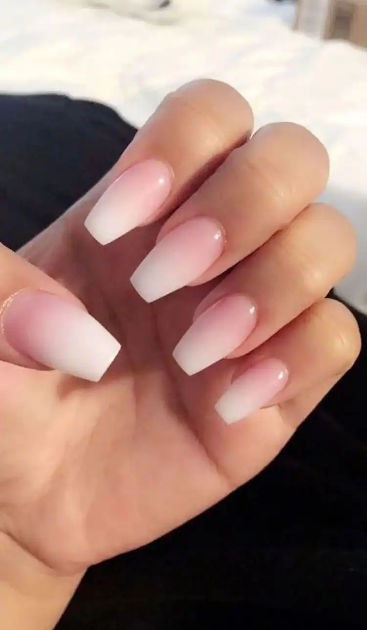 Graceful short coffin nude nails, illustrating how simple designs can be wonderfully elegant and versatile for any look.